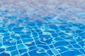 Swimming pool blur water with wavy reflective blue tile underwater in cool blue color for summer background Royalty Free Stock Photo