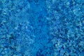 Swimming pool bottom caustics ripple and flow with waves background. Surface of blue swimming pool, background of water. Royalty Free Stock Photo