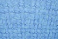 Swimming pool bottom. Close up view of blue mosaic tiles in the pool. Blue abstract ceramic tile. Royalty Free Stock Photo