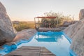 Swimming pool between boulders on a hill at Hoada Camp Royalty Free Stock Photo