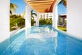 Swimming pool at caribbean resort. Royalty Free Stock Photo