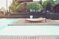 Swimming pool chair on the resort close to the beach, look at beautiful sea view. Royalty Free Stock Photo