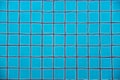 Swimming pool clear water showing turquoise blue clay square tiles and grey cement grout lines underwater wave copyspace Royalty Free Stock Photo