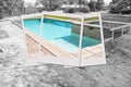 Swimming Pool Construction Site with Picture Photo Frame Containing Finished Project