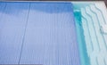 Swimming pool cover detail for protection and heat the water, pool roller-shutter covers Royalty Free Stock Photo