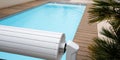 Swimming pool cover detail for protection and heating hot blue water Royalty Free Stock Photo