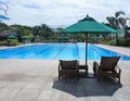 Swimming Pool Deck Chairs and Umbrella Royalty Free Stock Photo