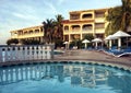 Swimming pool deck at tropical resort Royalty Free Stock Photo