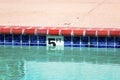 Swimming pool depth marker identifies the water depth for swimmers. Five feet depth sign Royalty Free Stock Photo