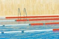 Swimming pool with divided lanes for competition and training and stairs for getting out and diving in the open air Royalty Free Stock Photo