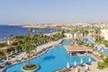 Swimming pool early in the morning next to the red sea in the resort hotel in Sharm El Sheikh, South Sinai, Egypt Royalty Free Stock Photo