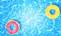 Swimming pool with two floating rings, caustic ripple and sunlight glare effect. Aquatic surface with waves background. Realistic Royalty Free Stock Photo