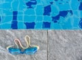 Swimming pool goggles on the poolside Royalty Free Stock Photo