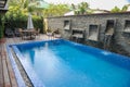 Swimming pool of hotel.Beautiful luxury outdoor swimming pool with stair in hotel and resort for holiday travel Royalty Free Stock Photo