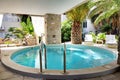 Swimming pool at hotel in traditional Greek style Royalty Free Stock Photo