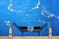 Swimming Pool Ladder with Reflection Royalty Free Stock Photo