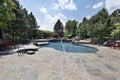 Swimming pool with large stone patio