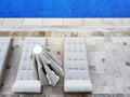 Swimming pool with lounge beds Royalty Free Stock Photo