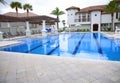 Swimming pool with lounge chairs Royalty Free Stock Photo