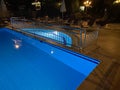 Swimming pool at luxury caribbean resort at night, dawn time Royalty Free Stock Photo