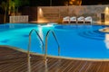 Swimming pool at a luxury Caribbean, tropical resort at night, dawn time. Royalty Free Stock Photo