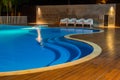 Swimming pool at a luxury Caribbean, tropical resort at night, dawn time. Royalty Free Stock Photo