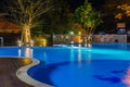 Swimming pool at a luxury Caribbean, tropical resort at night, dawn time. Royalty Free Stock Photo