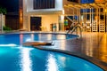 Swimming pool at a luxury Caribbean, tropical resort at night, dawn time. Royalty Free Stock Photo