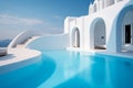 Swimming pool at luxury greek island hotel with cyclades style arched architecture on island. Royalty Free Stock Photo