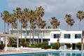 Swimming pool in luxury hotel, palm trees. Royalty Free Stock Photo