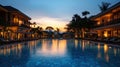 Swimming pool in luxury hotel resort at dusk. Luxury resort Royalty Free Stock Photo