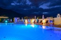 Swimming pool at a luxury resort by night in Lana