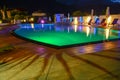 Swimming pool at a luxury resort by night in Lana