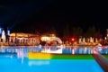 Swimming pool at a luxury resort at night time Royalty Free Stock Photo