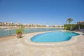 Swimming pool at at luxury tropical holiday villa with beach Royalty Free Stock Photo