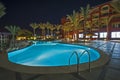 Swimming pool in luxury tropical hotel resort at night Royalty Free Stock Photo