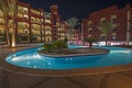 Swimming pool in luxury tropical hotel resort at night Royalty Free Stock Photo