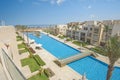 Swimming pool in a luxury tropical hotel resort with sea view Royalty Free Stock Photo