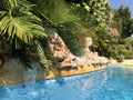 Swimming pool in a Mediterranean garden Royalty Free Stock Photo