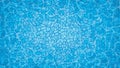 Swimming pool with mosaic tiles. Overhead view. Texture of water surface.