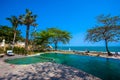 Swimming pool near the beach at high class resort Royalty Free Stock Photo