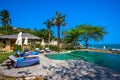 Swimming pool near the beach at high class resort Royalty Free Stock Photo