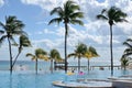 A swimming pool near the sea with palms. Royalty Free Stock Photo