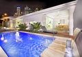 Swimming pool at night with city views from the distance Royalty Free Stock Photo