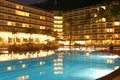 Swimming pool, night and palm Royalty Free Stock Photo