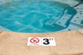 Swimming pool with No Diving warning sign and 3 ft depth marker Royalty Free Stock Photo