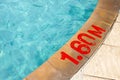 Swimming pool with Number 1.60 on ground at hotel Royalty Free Stock Photo