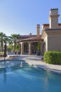 Swimming pool outside luxury mansion Royalty Free Stock Photo