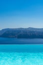 Swimming pool over Santorini caldera Royalty Free Stock Photo
