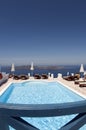 Swimming pool over sea santorini Royalty Free Stock Photo